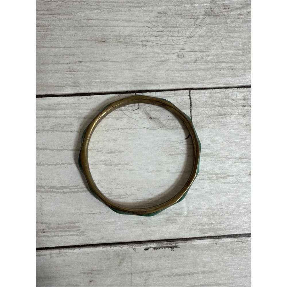 Vintage brass bangle bracelet with turquoise-colored inlay.